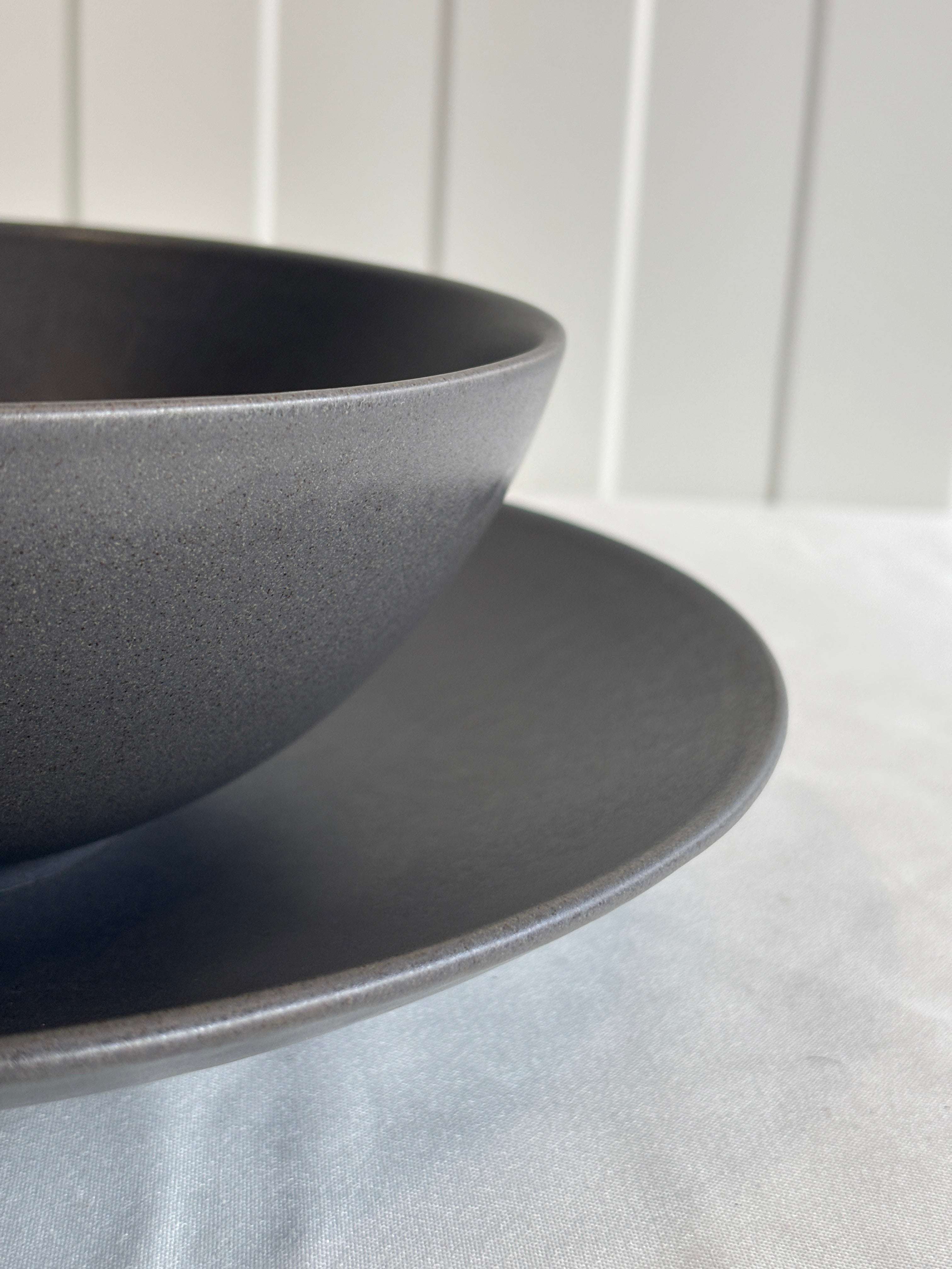 Set of flat plate and bowl in anthracite grey stoneware ceramic with a matte effect